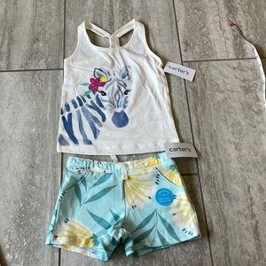 Carter’s pair of cream top w/unicorn & green with yellow flowers 2t/2A for girls